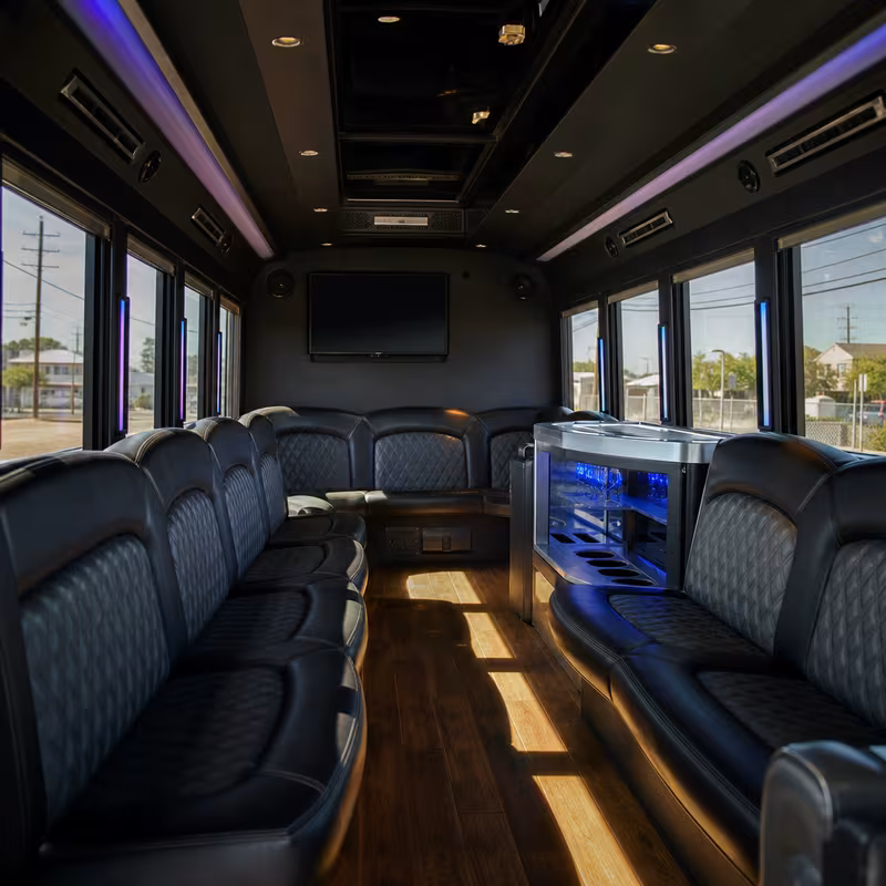 Friends laughing during a Long Beach party bus celebration
