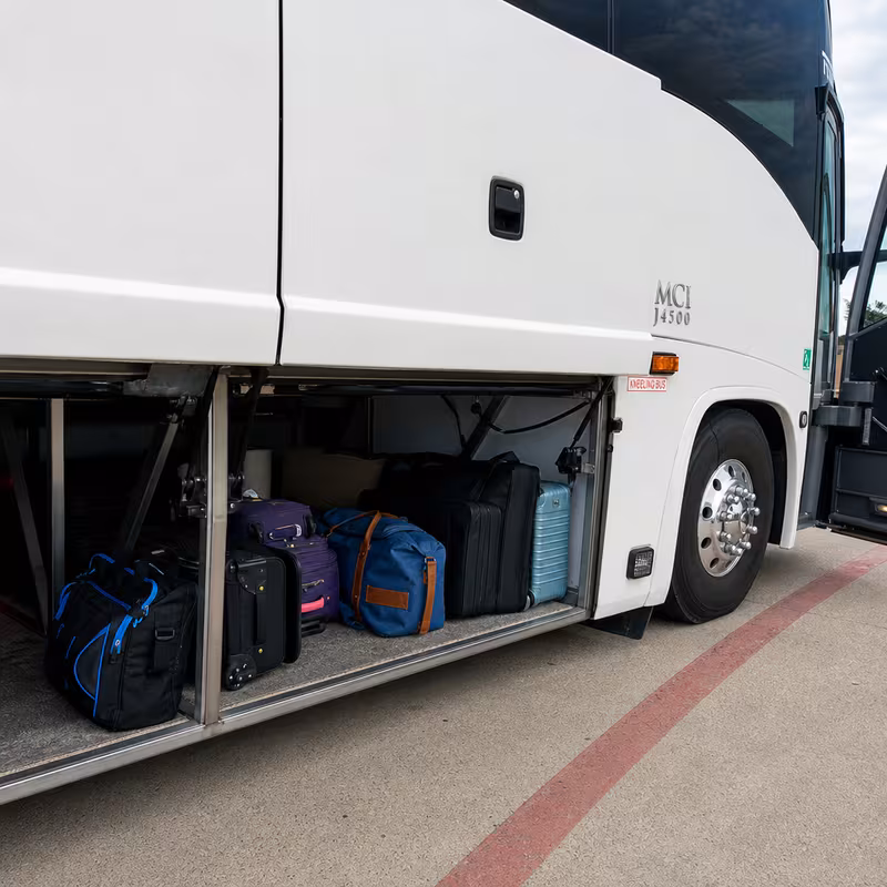Party bus interior with wraparound leather seating and LED lighting in Long Beach