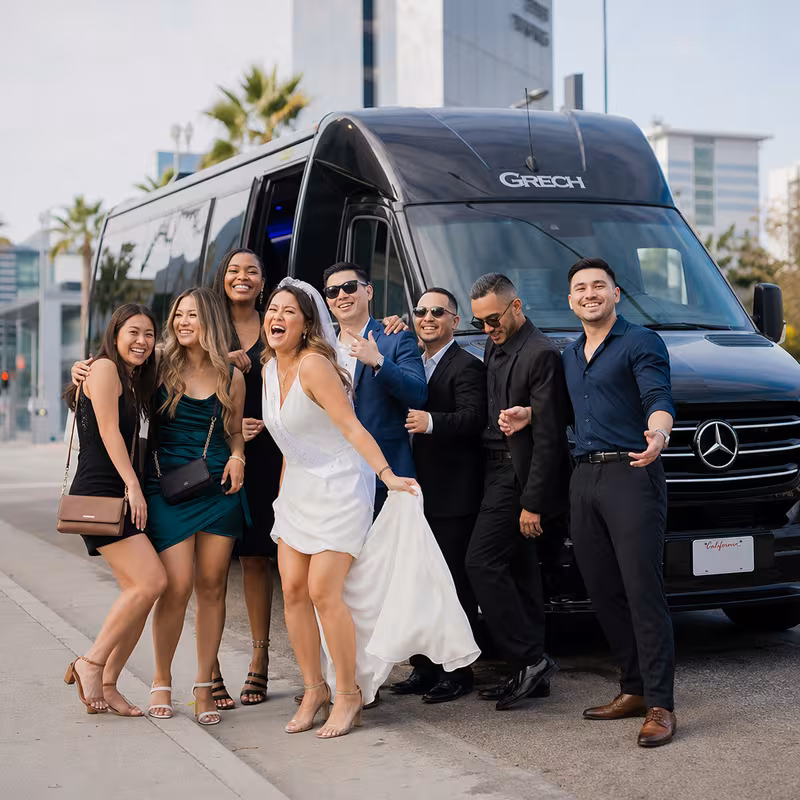 Group boarding a white charter bus for Bachelor & Bachelorette Transportation transportation in Long Beach
