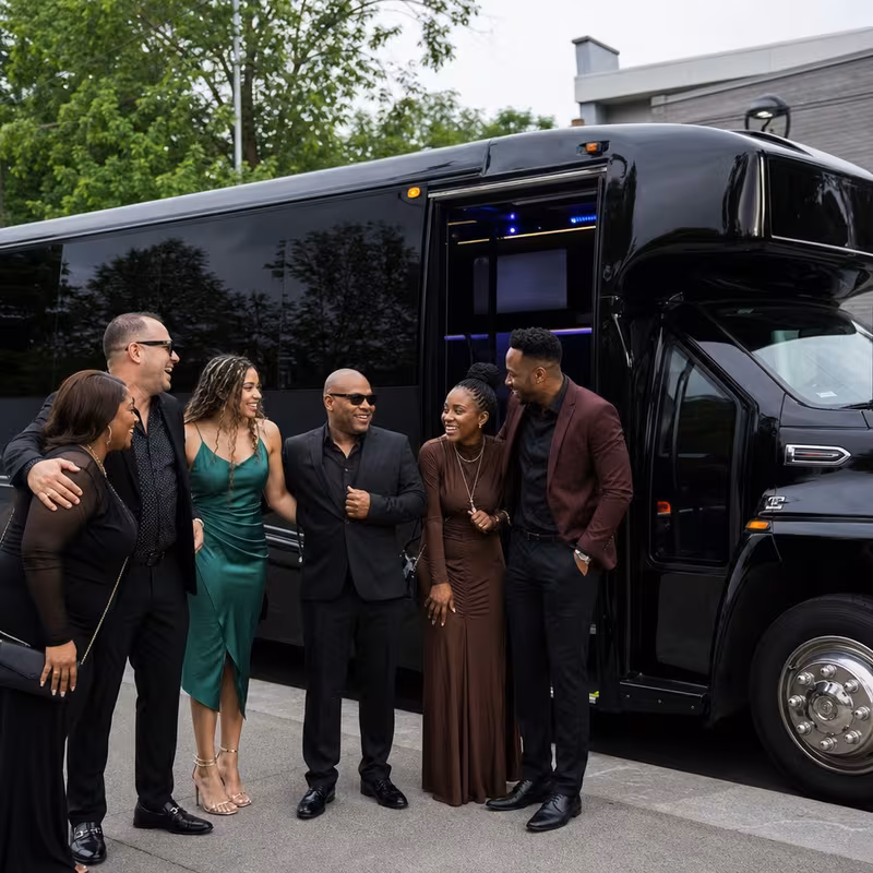 Passengers loading luggage while boarding a Long Beach group shuttle