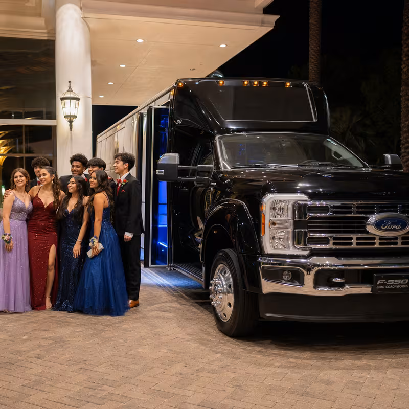 Party bus interior with wraparound leather seating and LED lighting in Long Beach